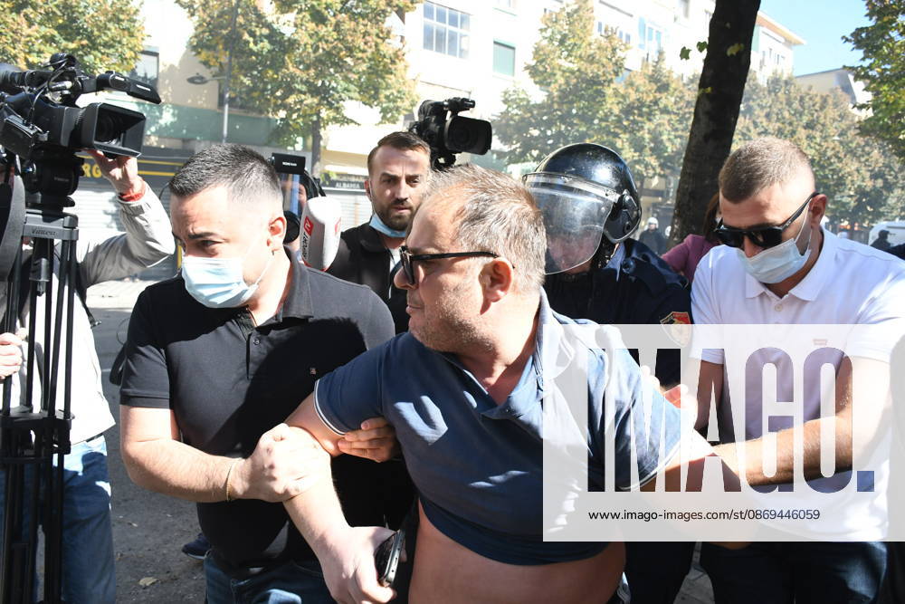Clashes erupt outside Ministry of Education in Tirana during student protest over academic conditions TIRANA, ALBANIA - OCTOBER 14: University students stage protest outside the Ministry of Education building in Tirana, Albania, on October 14, 2026. A protest organized by university students demanding improvements to educational infrastructure and funding escalated into violent clashes as civic supporters joined the crowds. Demonstrators hurled Molotov cocktails, stones, and improvised projectiles at the ministry and law enforcement officers, setting fire to trash containers. In response, law enforcement officers used water cannons and tear gas to disperse the protesters. Olsi Shehu Anadolu Tirana Albania. Editorial use only. Please get i