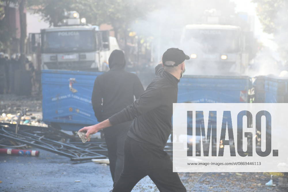 Clashes erupt outside Ministry of Education in Tirana during student protest over academic conditions TIRANA, ALBANIA - OCTOBER 14: University students stage protest outside the Ministry of Education building in Tirana, Albania, on October 14, 2026. A protest organized by university students demanding improvements to educational infrastructure and funding escalated into violent clashes as civic supporters joined the crowds. Demonstrators hurled Molotov cocktails, stones, and improvised projectiles at the ministry and law enforcement officers, setting fire to trash containers. In response, law enforcement officers used water cannons and tear gas to disperse the protesters. Olsi Shehu Anadolu Tirana Albania. Editorial use only. Please get i