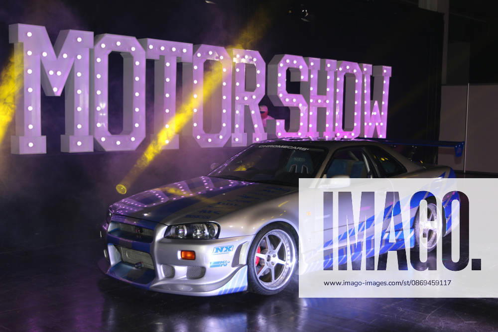 1999 Nissan Skyline R34 GT-R, original movie car from the 2003 film *2 Fast 2 Furious*, on display by ChromeCars in front of the Motor Show sign, Media event Carwalk for the Essen Motor Show on October 14, 2026, at Messe Essen in the run-up to the Essen Motor Show 2026 (November 28, 2026 – December 6, 2026), EMS Preview on November 27, 2026