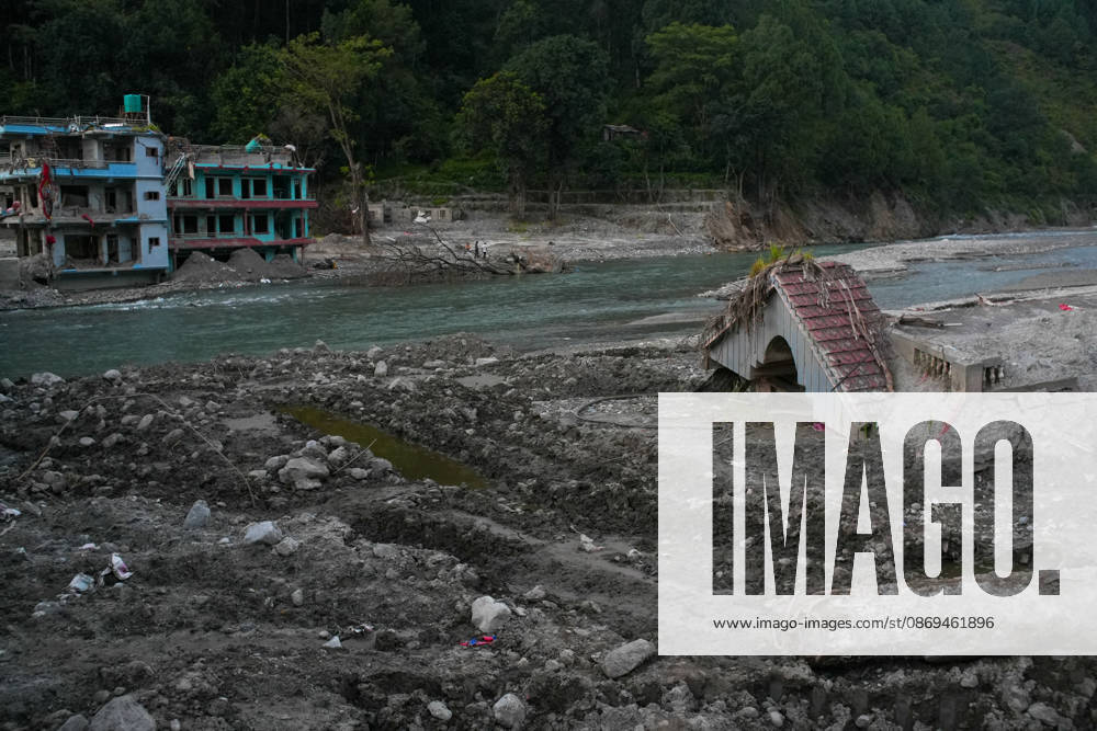Aftermath of flash floods in Nepal NUWAKOT, NEPAL - OCTOBER 14 : Houses damaged by devastating flash floods are seen in Betrabati, Nuwakot district, Nepal on October 14, 2026. Road and pedestrian connectivity has been restored with the construction of a new suspension bridge over the Trishuli River, allowing local residents to cross the river after the devastating floods damaged bridges and other infrastructure in the area. Sunil Pradhan Anadolu Nuwakot Nepal. Editorial use only. Please get in touch for any other usage.