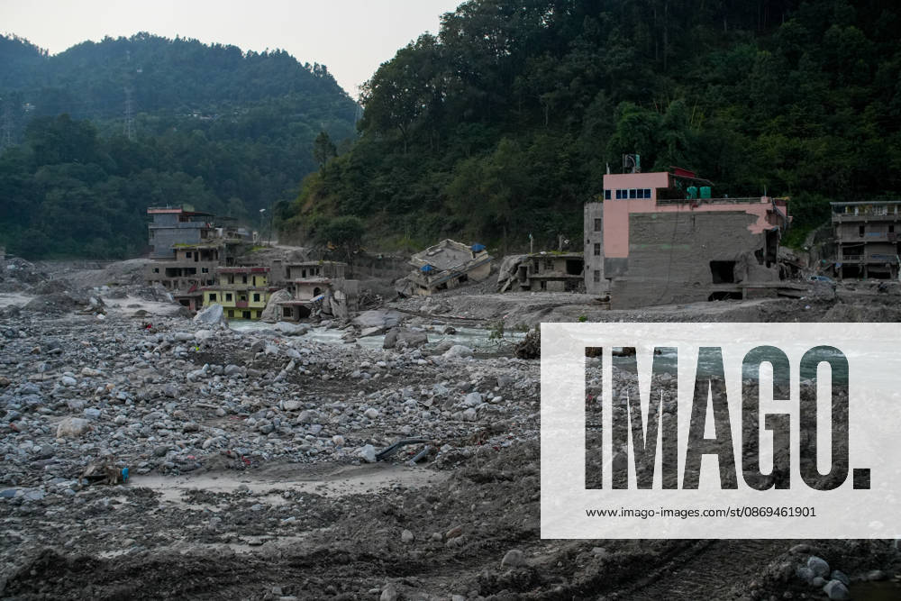 Aftermath of flash floods in Nepal RASUWA, NEPAL - OCTOBER 14 : Houses damaged by devastating flash floods are seen in Rasuwa district, Nepal on October 14, 2026. Road and pedestrian connectivity has been restored with the construction of a new suspension bridge over the Trishuli River, allowing local residents to cross the river after the devastating floods damaged bridges and other infrastructure in the area. Sunil Pradhan Anadolu Rasuwa Nepal. Editorial use only. Please get in touch for any other usage.