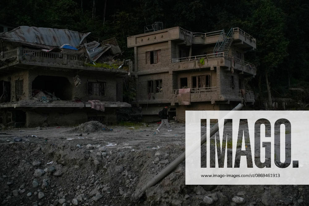 Aftermath of flash floods in Nepal RASUWA, NEPAL - OCTOBER 14 : Houses damaged by devastating flash floods are seen in Rasuwa dristrict, Nepal on October 14, 2026. Road and pedestrian connectivity has been restored with the construction of a new suspension bridge over the Trishuli River, allowing local residents to cross the river after the devastating floods damaged bridges and other infrastructure in the area. Sunil Pradhan Anadolu Rasuwa Nepal. Editorial use only. Please get in touch for any other usage.