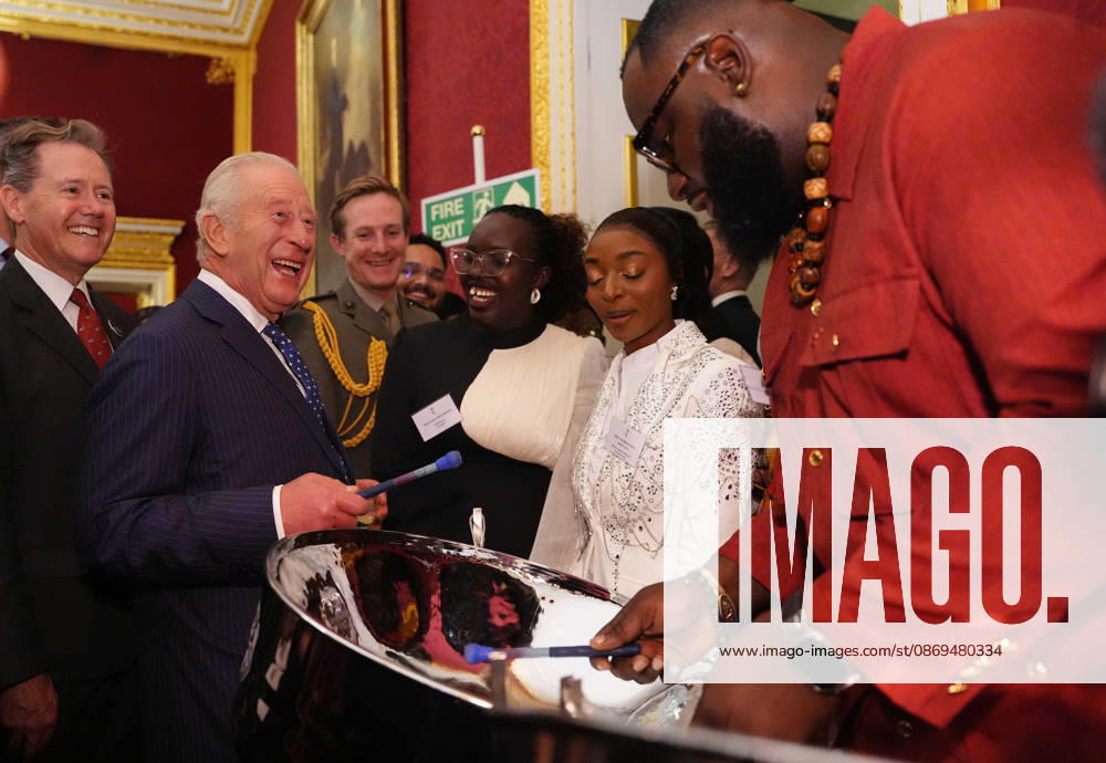 Commonwealth Diaspora reception King Charles III tries his hand at playing a steelpan drum with Khan Cordice during a reception at St. James s Palace in London, to celebrate the Commonwealth Diaspora, ahead of the Commonwealth Heads of Government Meeting in Antigua and Barbuda. Picture date: Wednesday October 14, 2026., Credit:Jonathan Brady PA ROTA - B68 Avalon UK, London