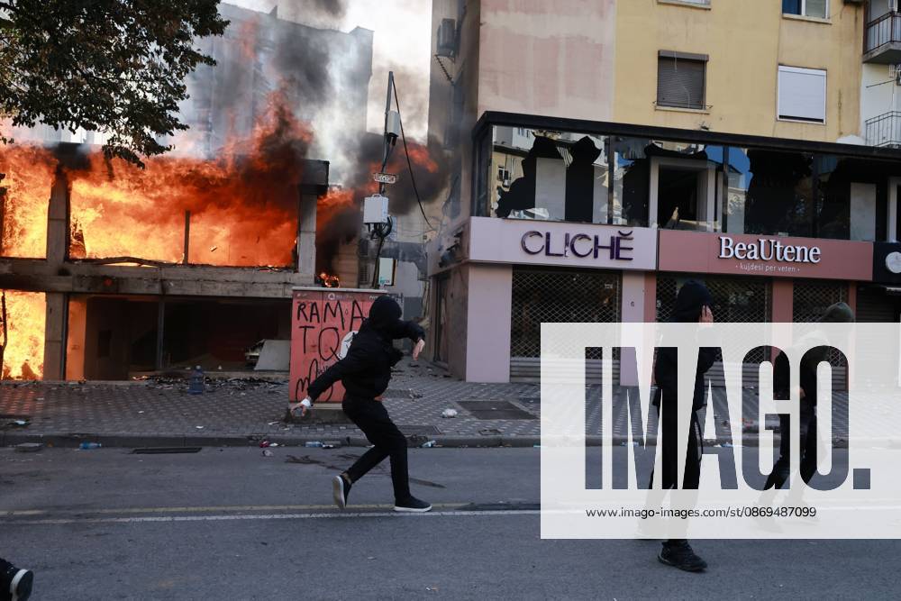 TIRANA, ALBANIA, OCTOBER 14, 2026: Demonstrators clash with riot police during student-led protests over rising education costs, university conditions and alleged corruption in Tirana. Fires damage the Ministry of Education and bank premises as protesters throw stones and other objects, while police use tear gas and water cannons. Tirana Albania - ZUMAq101 20261014_zna_q101_282