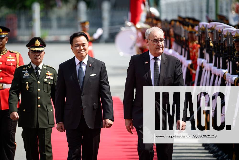 Swiss President Guy Parmelin Arrives in Thailand for Official Visit BANGKOK, THAILAND - OCTOBER 15, 2026: Thailands Prime Minister Anutin Charnvirakul (L) and Swiss President Guy Parmelin (R) inspect an honour guard at Government House in Bangkok during Parmelins official visit to Thailand as a guest of the government. Bangkok