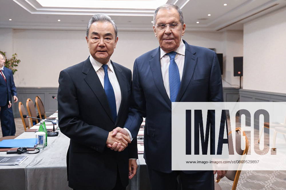 AZERBAIJAN, BAKU - OCTOBER 15, 2026: Russia s Foreign Minister Sergei Lavrov and his counterpart Wang Yi of China shake hands during a meeting held as part of the Conference on Interaction and Confidence-Building Measures in Asia (CICA) summit. Video screen grab. Best quality available. Russian Foreign Ministry TASS 99333021