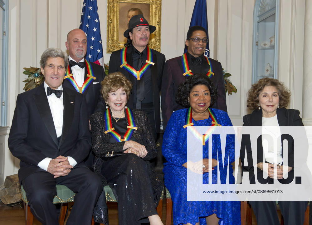 **FILE PHOTO** Martina Arroyo Has Passed Away. The five recipients of the 2013 Kennedy Center Honors pose for a group photo following a dinner hosted by United States Secretary of State John F. Kerry at the U.S. Department of State in Washington, D.C. on Saturday, December 1, 2013. The 2013 honorees are opera singer Martina Arroyo; pianist, keyboardist, bandleader and composer Herbie Hancock; pianist, singer and songwriter Billy Joel; actress Shirley MacLaine; and musician and songwriter Carlos Santana. Seated in the front row are: U.S. Secretary of State John Kerry, Shirley MacLain, Martina Arroyo, and Teresa Heinz Kerry. Standing are Billy Joel, Carlos Santana, and Herbie Hancock.