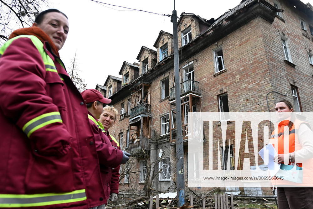 Aftermath Of A Russian Drone Attack In Kyiv, 15 Oct 2026 Municipal workers stand in front of a damaged residential building following an explosion caused by a Geran-5 jet-powered drone in Kyiv, Ukraine, on October 15, 2026. Kyiv Ukraine
