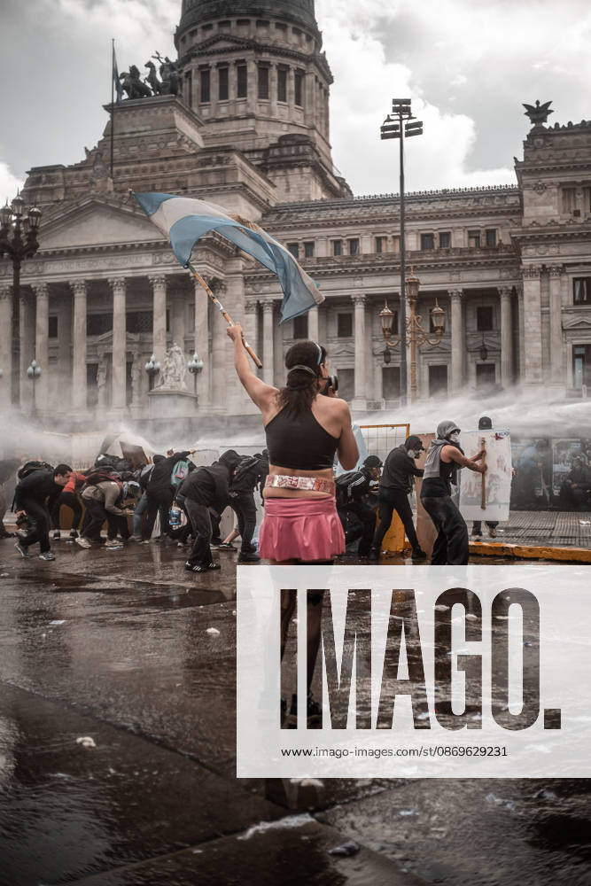 Police forces deploy tear gas, water cannon trucks and rubber bullets against demonstrators during the Fifth Federal University March near Congress, as protesters demand the implementation of the University Funding Law and oppose President Javier Mileis austerity policies. The protest takes place amid the governments broader deregulation agenda, including Decree 70 2023 Buenos Aires Argentina - ZUMAf175 20261015_zip_f175_013