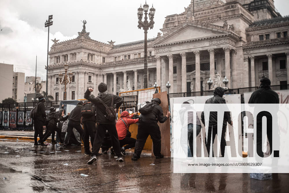 Police forces deploy tear gas, water cannon trucks and rubber bullets against demonstrators during the Fifth Federal University March near Congress, as protesters demand the implementation of the University Funding Law and oppose President Javier Mileis austerity policies. The protest takes place amid the governments broader deregulation agenda, including Decree 70 2023 Buenos Aires Argentina - ZUMAf175 20261015_zip_f175_025