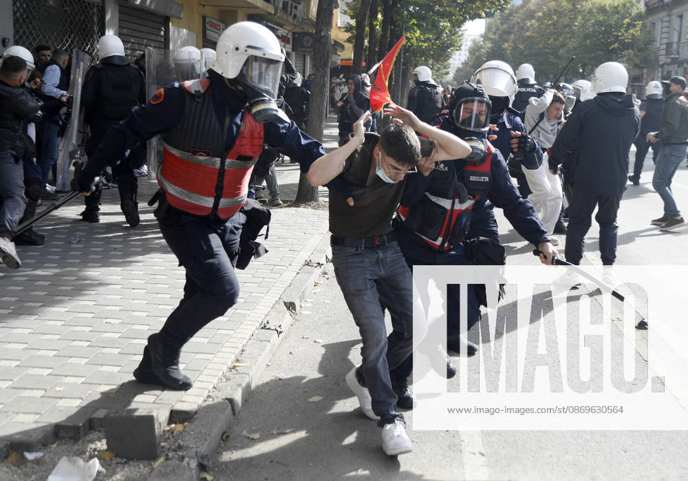 Protesters Clash with Police During a Demonstration in Tirana, Albania. Riot police detain a protester during an anti-government demonstration in central Tirana on October 15, 2026, as protests continued for a third consecutive day over university conditions and demands for the resignation of Albanian Prime Minister Edi Rama. The latest rally follows two nights of violence in the capital, during which protesters and riot police clashed, police used water cannons and tear gas, and demonstrators damaged government offices and shops and set fire to several buildings. Light Studio Agency Malton Dibra Tirana Albania