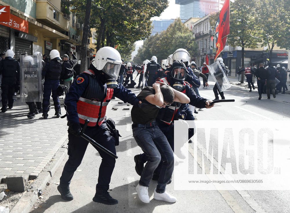 Protesters Clash with Police During a Demonstration in Tirana, Albania. Riot police detain a protester during an anti-government demonstration in central Tirana on October 15, 2026, as protests continued for a third consecutive day over university conditions and demands for the resignation of Albanian Prime Minister Edi Rama. The latest rally follows two nights of violence in the capital, during which protesters and riot police clashed, police used water cannons and tear gas, and demonstrators damaged government offices and shops and set fire to several buildings. Light Studio Agency Malton Dibra Tirana Albania