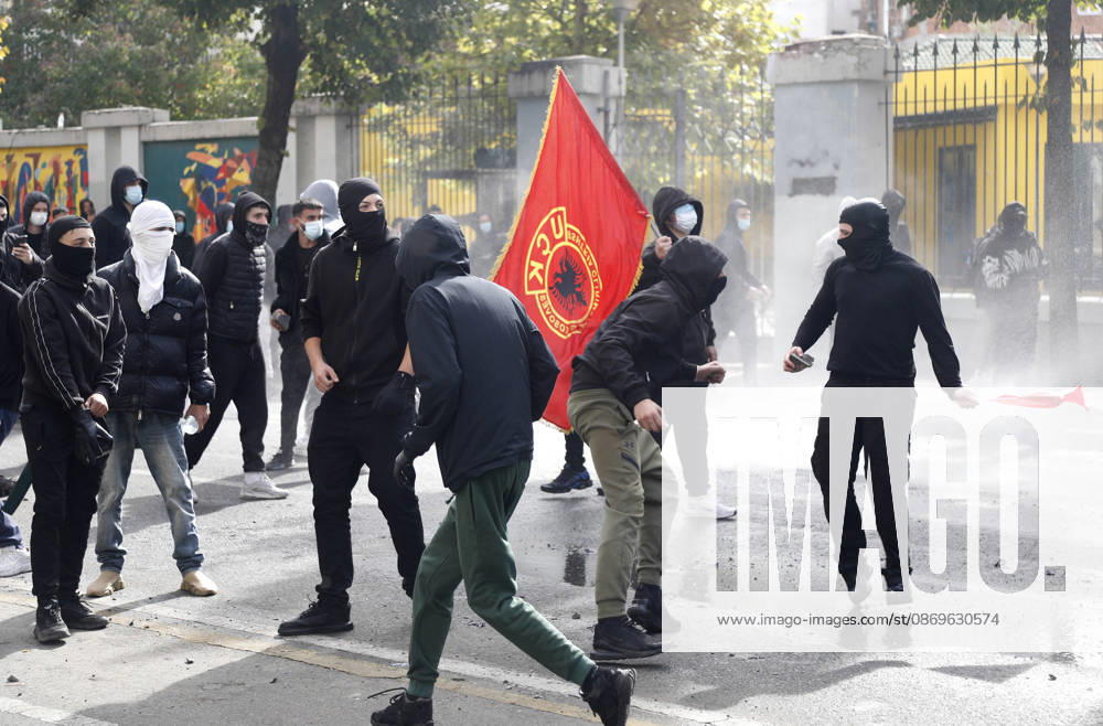 Protesters Clash with Police During a Demonstration in Tirana, Albania. Protesters throw stones at riot police during an anti-government demonstration in central Tirana on October 15, 2026, as protests continued for a third consecutive day over university conditions and demands for the resignation of Albanian Prime Minister Edi Rama. The latest rally follows two nights of violence in the capital, during which protesters and riot police clashed, police used water cannons and tear gas, and demonstrators damaged government offices and shops and set fire to several buildings. Light Studio Agency Malton Dibra Tirana Albania