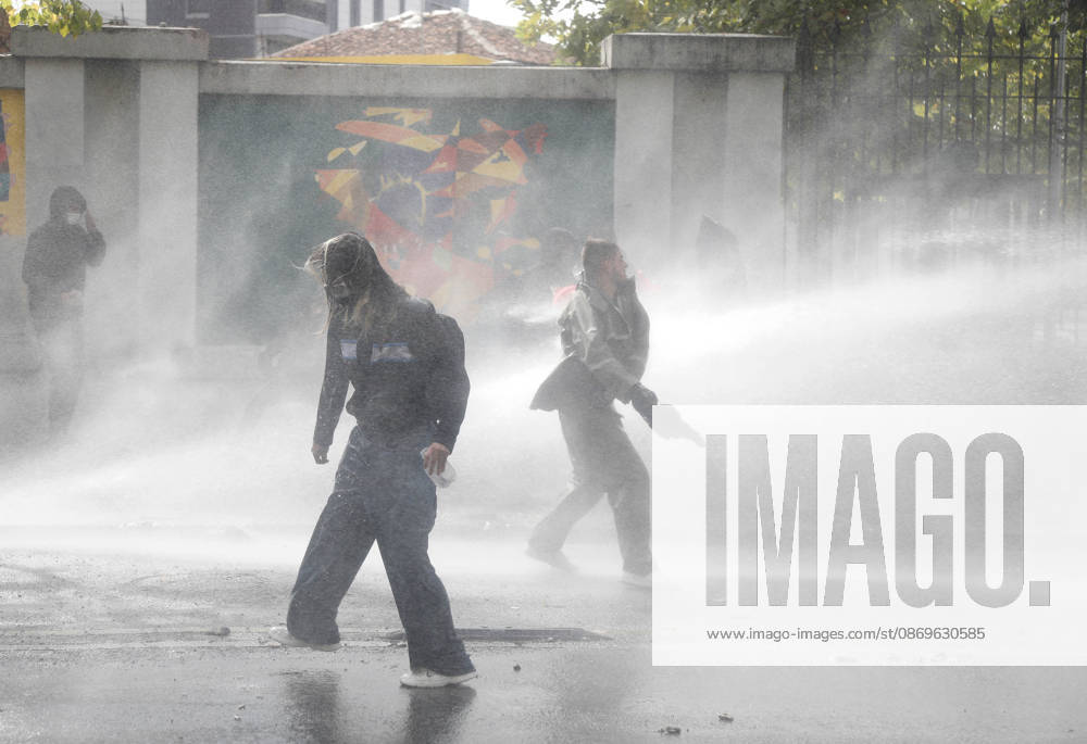 Protesters Clash with Police During a Demonstration in Tirana, Albania. Protesters throw stones at riot police during an anti-government demonstration in central Tirana on October 15, 2026, as protests continued for a third consecutive day over university conditions and demands for the resignation of Albanian Prime Minister Edi Rama. The latest rally follows two nights of violence in the capital, during which protesters and riot police clashed, police used water cannons and tear gas, and demonstrators damaged government offices and shops and set fire to several buildings. Light Studio Agency Malton Dibra Tirana Albania