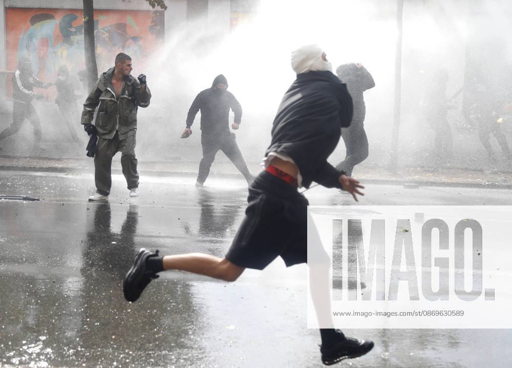Protesters Clash with Police During a Demonstration in Tirana, Albania. Protesters throw stones at riot police during an anti-government demonstration in central Tirana on October 15, 2026, as protests continued for a third consecutive day over university conditions and demands for the resignation of Albanian Prime Minister Edi Rama. The latest rally follows two nights of violence in the capital, during which protesters and riot police clashed, police used water cannons and tear gas, and demonstrators damaged government offices and shops and set fire to several buildings. Light Studio Agency Malton Dibra Tirana Albania
