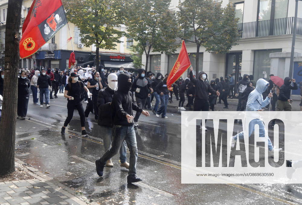 Protesters Clash with Police During a Demonstration in Tirana, Albania. Protesters throw stones at riot police during an anti-government demonstration in central Tirana on October 15, 2026, as protests continued for a third consecutive day over university conditions and demands for the resignation of Albanian Prime Minister Edi Rama. The latest rally follows two nights of violence in the capital, during which protesters and riot police clashed, police used water cannons and tear gas, and demonstrators damaged government offices and shops and set fire to several buildings. Light Studio Agency Malton Dibra Tirana Albania