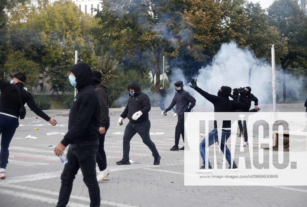 Protesters Clash with Police During a Demonstration in Tirana, Albania. Protesters throw stones at riot police during an anti-government demonstration in central Tirana on October 15, 2026, as protests continued for a third consecutive day over university conditions and demands for the resignation of Albanian Prime Minister Edi Rama. The latest rally follows two nights of violence in the capital, during which protesters and riot police clashed, police used water cannons and tear gas, and demonstrators damaged government offices and shops and set fire to several buildings. Light Studio Agency Malton Dibra Tirana Albania
