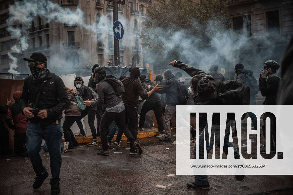 Police forces deploy tear gas, water cannon trucks and rubber bullets against demonstrators during the Fifth Federal University March near Congress, as protesters demand the implementation of the University Funding Law and oppose President Javier Milei s austerity policies. The protest takes place amid the government s broader deregulation agenda, including Decree 70 2023 Buenos Aires Argentina - ZUMAf175 20261015_zip_f175_002