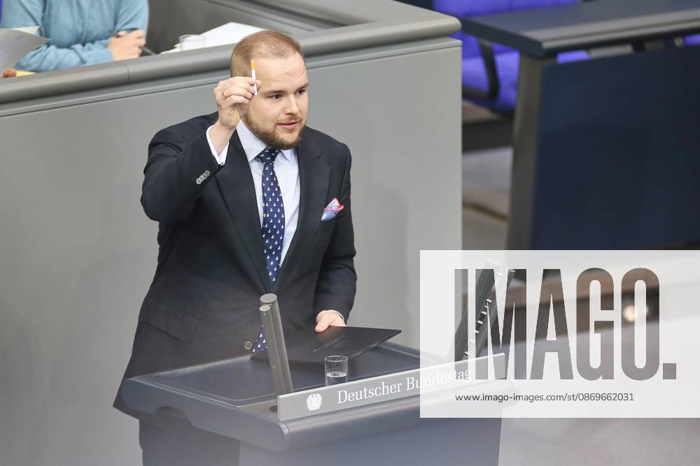 German Bundestag 102nd Session Torben Braga, AfD, is holding a cigarette in his hand