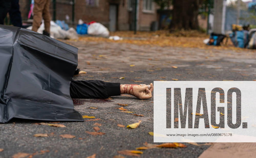 Drone attack on street market in Kharkiv kills 2, injures 13 KHARKIV, UKRAINE - OCTOBER 16: (EDITORS NOTE: Image depicts death) The body of a victim lies partially covered at the scene of a drone attack on a street market in Kharkiv, Ukraine, on October 16, 2026. The attack killed two people and injured 13 others. Carlo Bravo Anadolu Kharkiv Ukraine. Editorial use only. Please get in touch for any other usage.