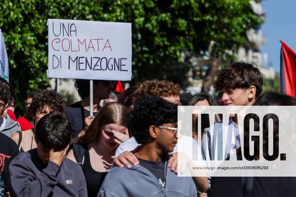 IPA89763007 - NAPLES, ITALY — OCTOBER 16, 2026: Environmental activists, students, and unemployed people take to the streets in the Bagnoli district of Naples to protest the city government’s handling of the environmental remediation of the former Italsider steelworks site. The demonstration focuses on the ongoing redevelopment work in the area, where facilities for the 38th Louis Vuitton America’s Cup—scheduled to take place in Naples in 2027—are being built. Protesters raise concerns about environmental protection, the remediation process, and the project’s impact on the local community.
