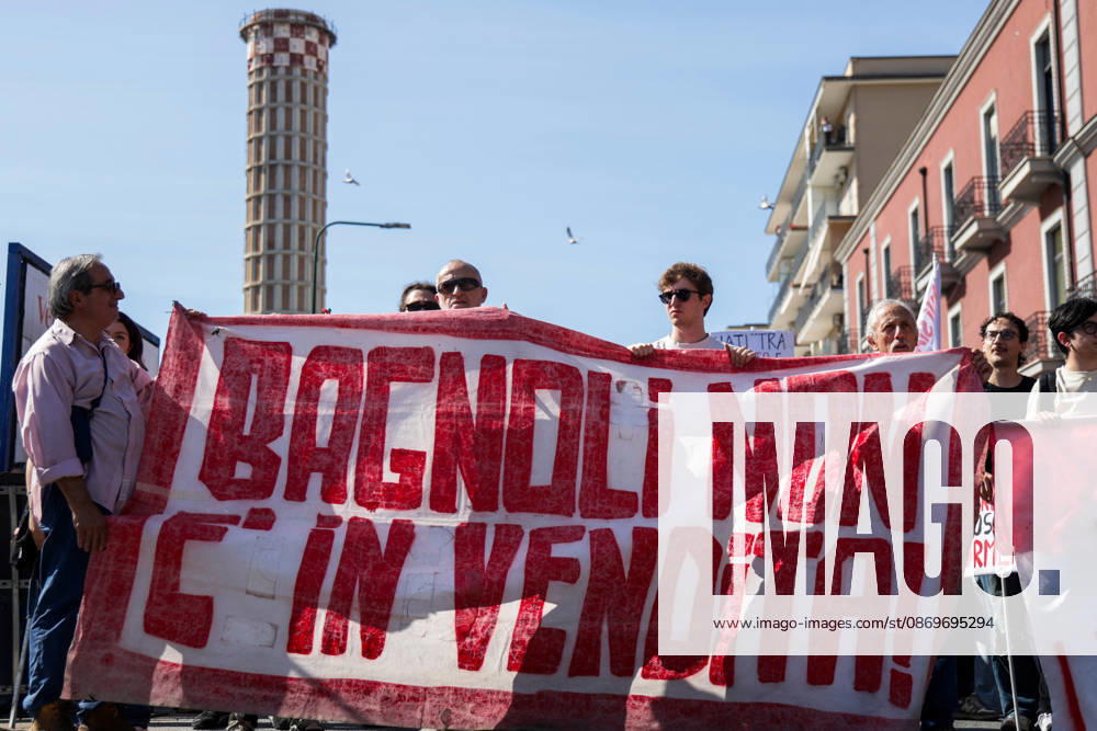 IPA89763008 - NAPLES, ITALY — OCTOBER 16, 2026: Environmental activists, students, and unemployed people take to the streets in the Bagnoli district of Naples to protest the municipal administration’s handling of the environmental remediation of the former Italsider steelworks site. The demonstration focuses on the ongoing redevelopment work in the area, where facilities for the 38th Louis Vuitton America’s Cup—scheduled to take place in Naples in 2027—are being built. Protesters raise concerns about environmental protection, the remediation process, and the project’s impact on the local community.