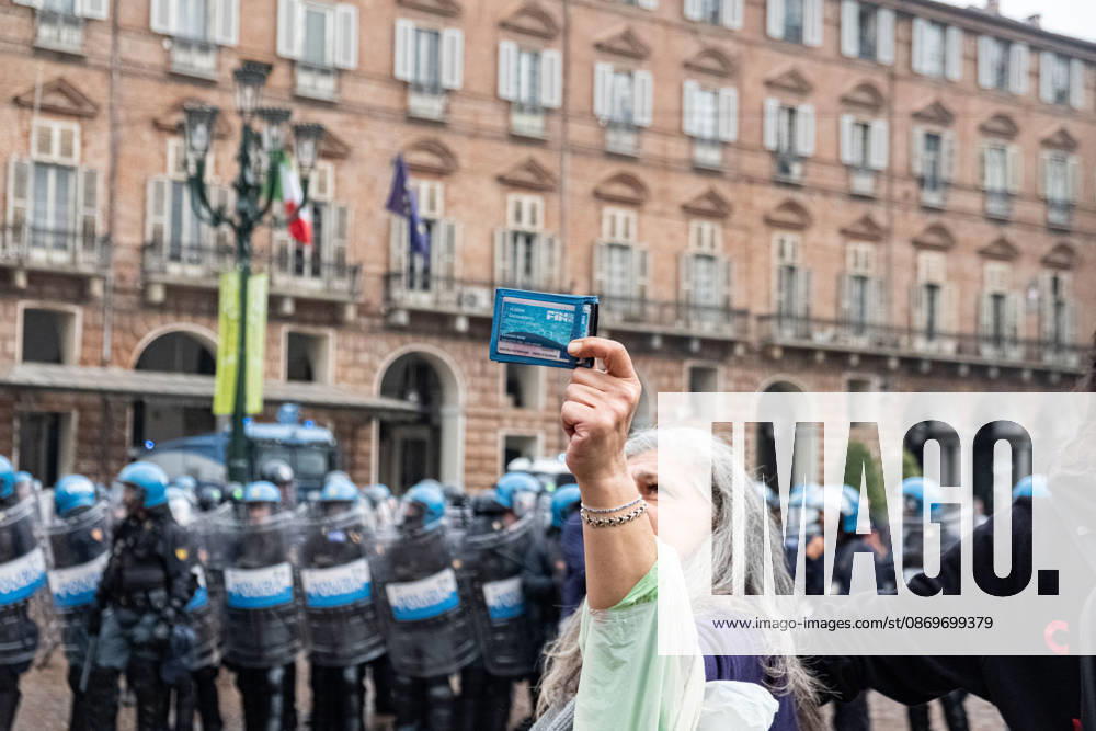 Reportage - Student strike in Turin A woman shows her ID badge as she forms a human chain to protect the students from the police during Student strike in Turin, Reportage in Turin, Italy, October 16 2026 Turin City of Turin Italy