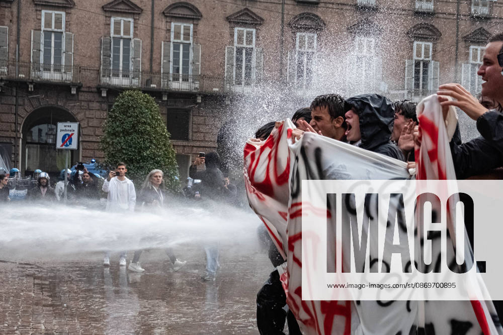 IPA89764432 - Police use water cannons against protesters in Piazza Castello during a student strike in Turin; Report from Turin, Italy
