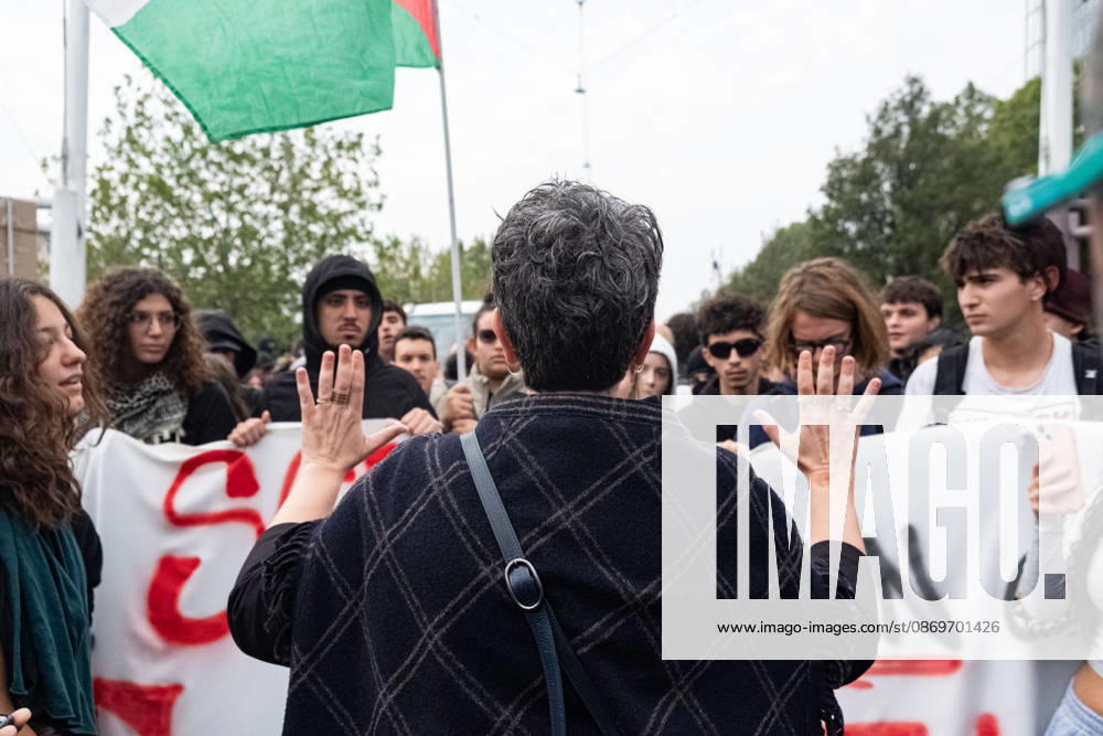 IPA89764451 - A teacher talking to students after speaking with the police during a student strike in Turin; Report from Turin, Italy