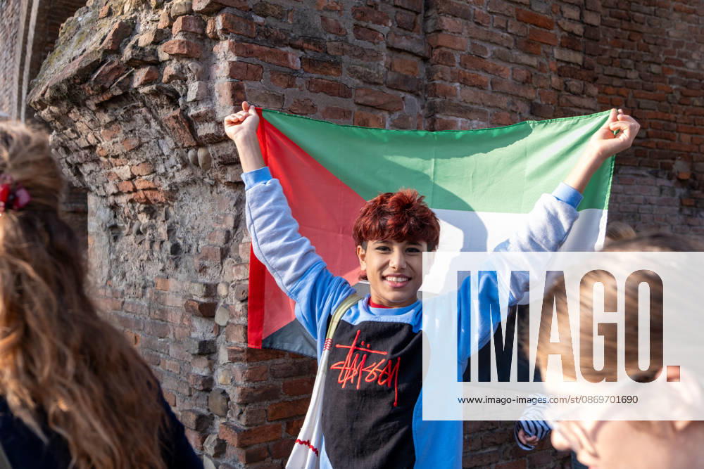 IPA89764844 - A student waves the Palestinian flag during a student strike. Bologna, Italy