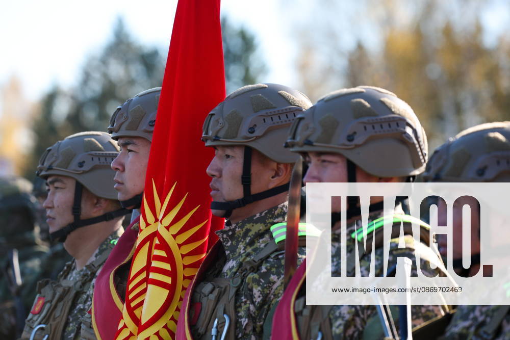 Servicemen appear with a national flag of Kyrgyzstan in the final live training phase of the Indestructible Brotherhood 2026 command-and-staff military exercise by the CSTO Peacekeeping Forces at the Losvido military training ground Belarus - ZUMAt113 20261016_zaa_t113_286