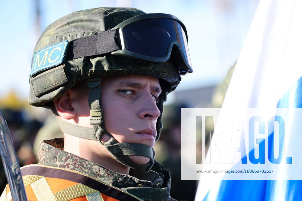 A serviceman appears with a national flag of Russia in the final live training phase of the Indestructible Brotherhood 2026 command-and-staff military exercise by the CSTO Peacekeeping Forces at the Losvido military training ground Belarus - ZUMAt113 20261016_zaa_t113_287