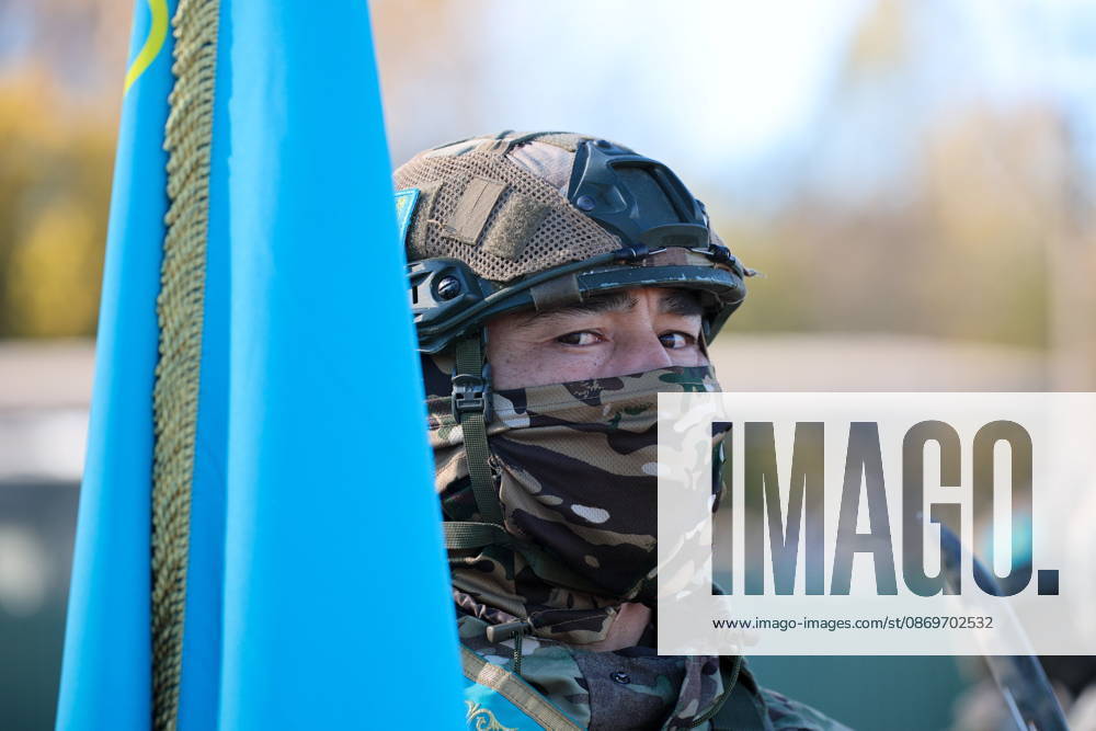 A serviceman appears with a national flag of Kazakhstan in the final live training phase of the Indestructible Brotherhood 2026 command-and-staff military exercise by the CSTO Peacekeeping Forces at the Losvido military training ground Belarus - ZUMAt113 20261016_zaa_t113_288