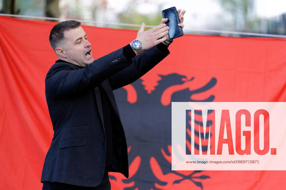 Solidarity Protest for Albania held in Berlin. A protester speaks in front of the Albanian flag as people gather opposite the Albanian embassy during a protest organized by ˜Flamingos von Berlin in Berlin, Germany, 16 October 2026. The organizers called for solidarity with students in Albania and denounced corruption, demanding the resignation of Edi Rama. Berlin
