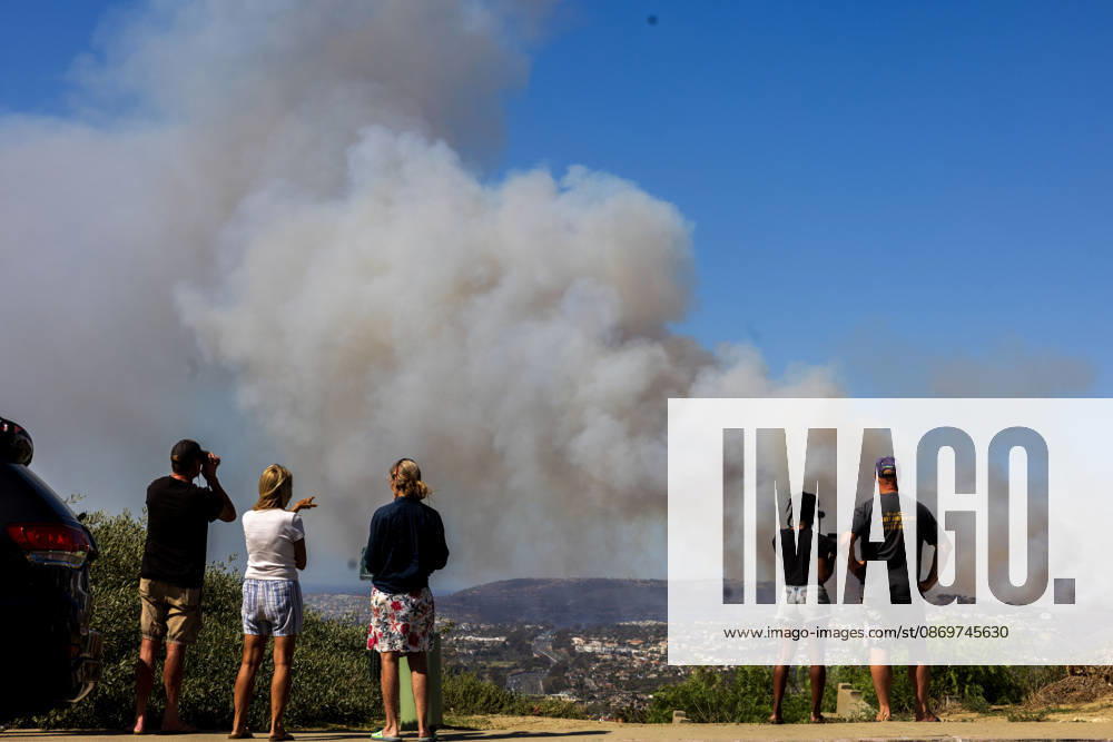 October16, 2026, San Juan Capistrano, California, USA: Fire crews are aggressively battling a wind-driven brush fire that burned several homes and threatened thousands of others in the area of San Juan Capistrano and San Clemente Friday, prompting evacuation orders. The Norte Fire exploded to 465 acres and remains 0 percent contained as of 4 p.m. O.C. Fire Authority officials said the Norte Fire started around 11:30 a.m. near Portico Del Norte and Eminencia Del Norte in San Clemente, east of Interstate 5. Fueled by strong Santa Ana winds, the wildfire then blew into neighboring San Juan Capistrano. San Juan Capistrano USA - ZUMAr19_ 20261016_new_r19_163