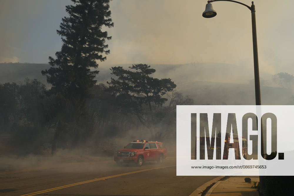 October16, 2026, San Juan Capistrano, California, USA: Fire crews are aggressively battling a wind-driven brush fire that burned several homes and threatened thousands of others in the area of San Juan Capistrano and San Clemente Friday, prompting evacuation orders. The Norte Fire exploded to 465 acres and remains 0 percent contained as of 4 p.m. O.C. Fire Authority officials said the Norte Fire started around 11:30 a.m. near Portico Del Norte and Eminencia Del Norte in San Clemente, east of Interstate 5. Fueled by strong Santa Ana winds, the wildfire then blew into neighboring San Juan Capistrano. San Juan Capistrano USA - ZUMAr19_ 20261016_new_r19_185