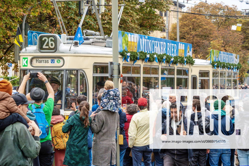 150th Anniversary Tram Parade in Munich, Stop at the Max Monument, October 17, 2026, Germany, Munich, October 17, 2026, 150th Anniversary Tram Parade in Munich, Stop at the Max Monument, Tram Line 26 to Harras, M-series car from 1957, hundreds of onlookers watch the parade, featur
