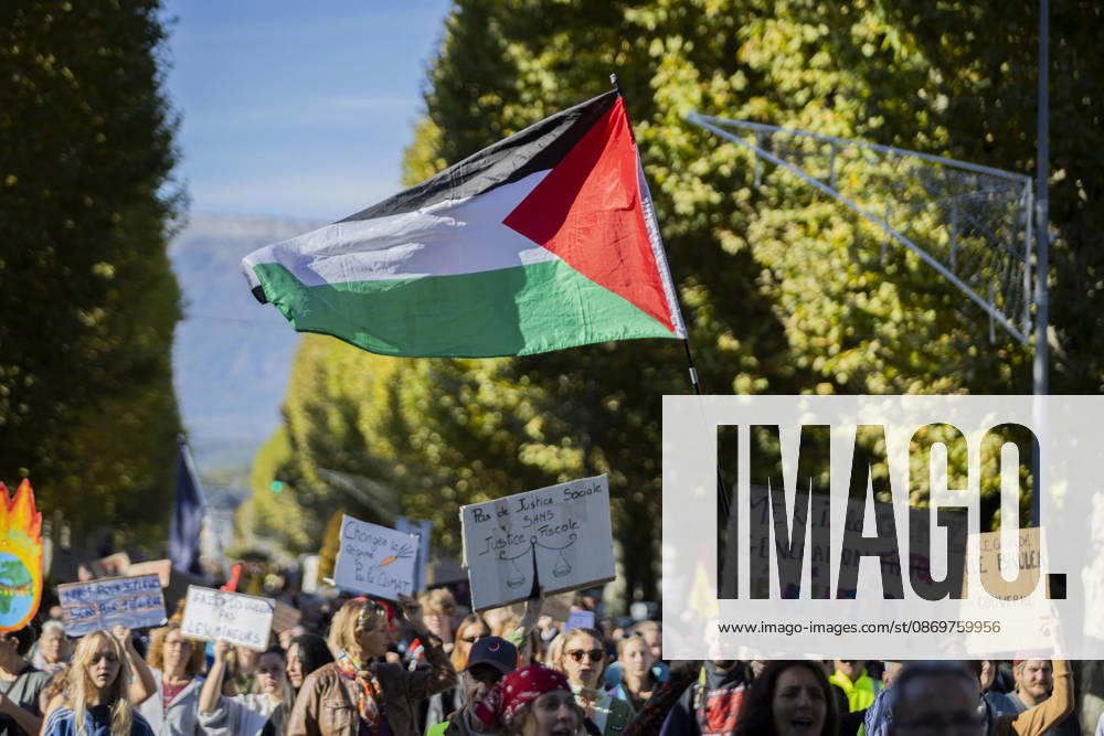 High Cost of Living Protest - Gap A Palestinian flag flies above demonstrators carrying signs during the march in Gap, France, on October 17, 2026. Photo by Thibaut Durand ABACAPRESS.COM Gap Provence-Alpes-Cote d Azur France