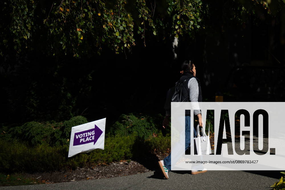 A woman walks past a sign directing people to a polling station in Vancouver, on Saturday Oct. 17, 2026. British Columbians are heading to the polls to cast their votes in municipal elections being held across the province. Port Moody CANADA - ZUMAc35_ 20261017_zaf_c35_019