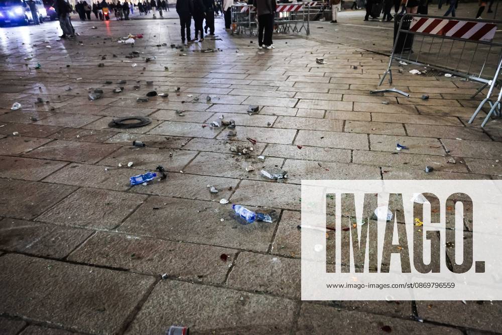 IPA89830549 - Milan: Damage caused by clashes between protesters and police during the Italia in Piazza demonstration against the high cost of living in the city center. Pictured: Damage in Piazza del Duomo