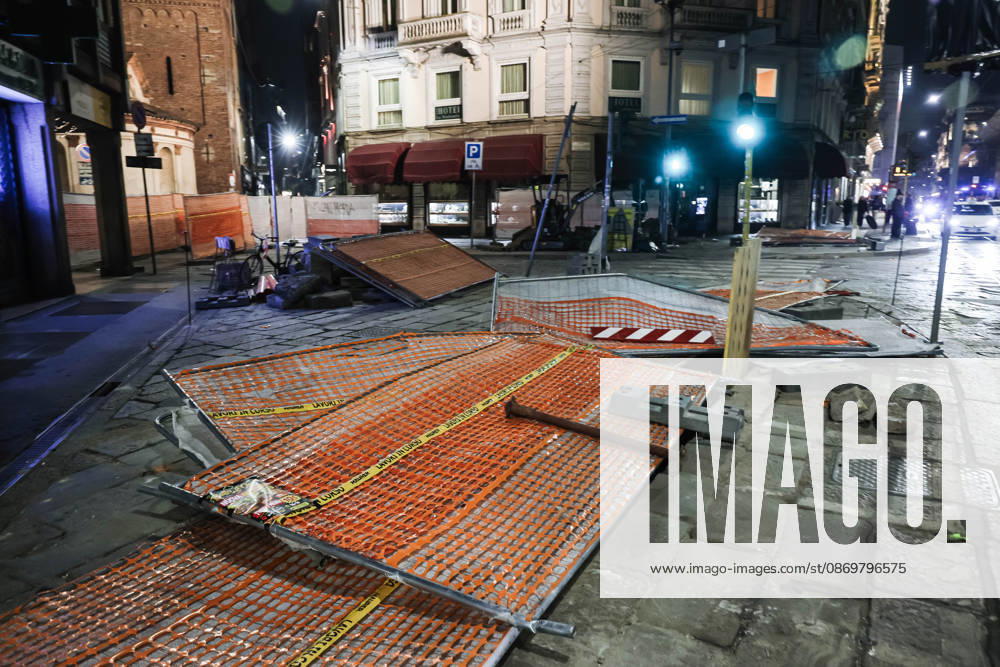 IPA89830555 - Milan: Damage caused by clashes between protesters and police during the Italia in Piazza demonstration against the high cost of living in the city center. Pictured: Damage on Missori Street