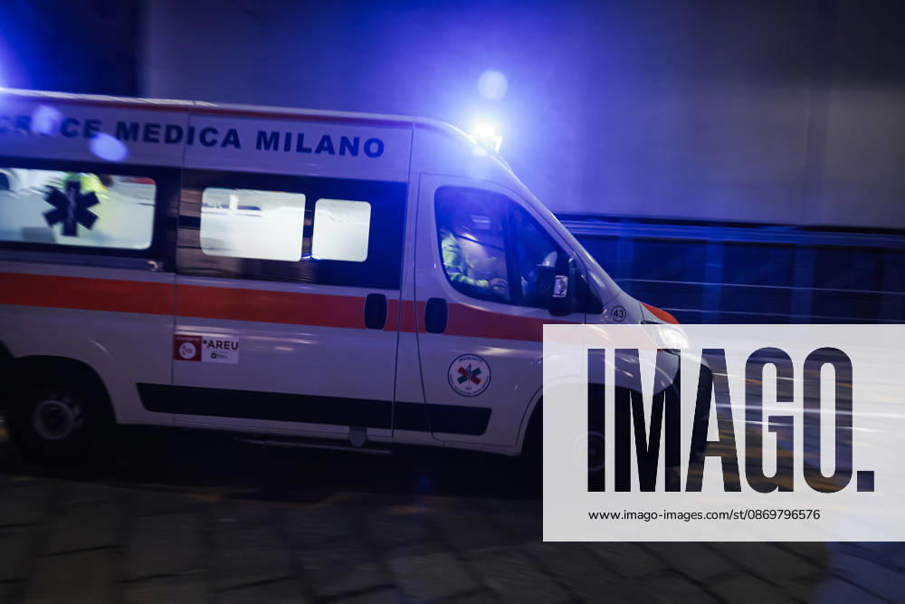 IPA89830556 - Milan: Damage caused by clashes between protesters and police during the Italia in Piazza demonstration against the high cost of living in the city center. Pictured: An ambulance on Missori Street