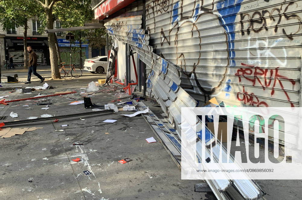 A man walks past a vandalised shop near Republique Square in Paris, on Sunday, October 18, 2026. Residents awoke to scenes of widespread damage with shopfronts shattered, burnt out cars, charred bikes, and piles of glass and debris on the pavements of the French capital a day after riots erupted during protests against rising fuel prices, the cost of living and deteriorating public services, including schools. PAR20261018113 MAYAxVIDON-WHITE