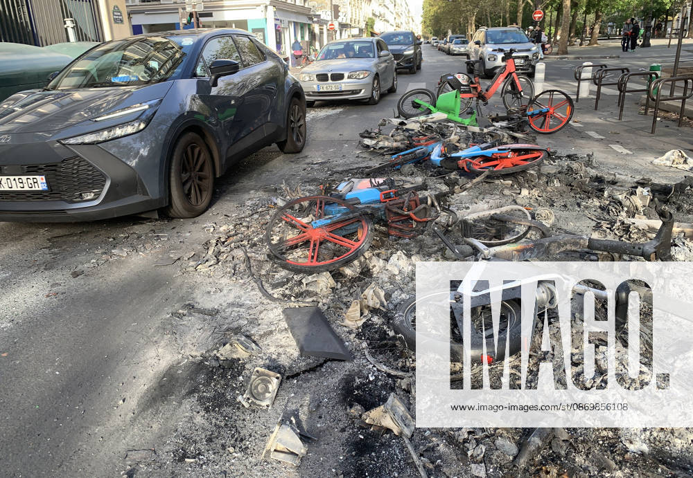 Cars avoid a pile of burnt-out bicyles near Republique Square in Paris, on Sunday, October 18, 2026. Residents awoke to scenes of widespread damage with shopfronts shattered, burnt out cars, charred bikes, and piles of glass and debris on the pavements of the French capital a day after riots erupted during protests against rising fuel prices, the cost of living and deteriorating public services, including schools. PAR20261018117 MAYAxVIDON-WHITE