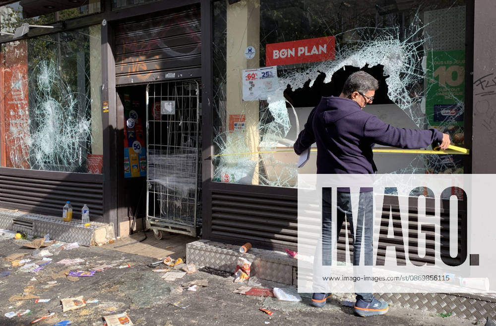 A shop owner measures the damage to his vandalised grocery store near Republique Square in Paris, on Sunday, October 18, 2026. Residents awoke to scenes of widespread damage with shopfronts shattered, burnt out cars, charred bikes, and piles of glass and debris on the pavements of the French capital a day after riots erupted during protests against rising fuel prices, the cost of living and deteriorating public services, including schools. PAR20261018119 MAYAxVIDON-WHITE