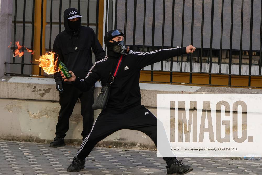 TIRANA, ALBANIA, OCTOBER 18, 2026: Demonstrators clash with riot police outside the Ministry of Education in Tirana as student-led anti-government protests continue for a sixth consecutive day. Protesters throw stones while police respond with tear gas, water cannons and rubber bullets. The demonstrations demand improved university conditions and the resignation of Prime Minister Edi Rama. Tirana Albania - ZUMAq101 20261018_zna_q101_063