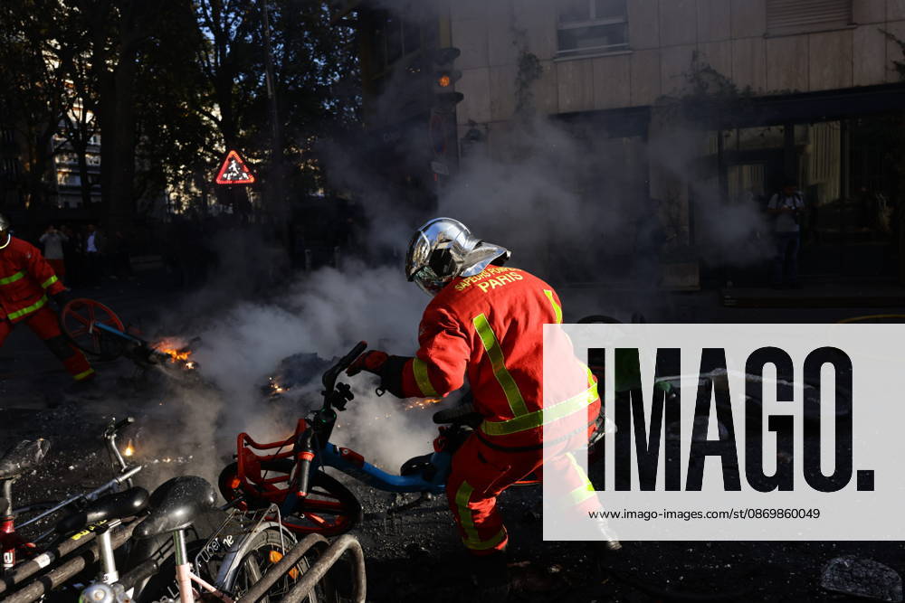 Aftermath of clashes during nationwide protests in Paris PARIS, FRANCE - OCTOBER 18: Firefighters extinguish fires set to bicycles and street debris as streets across Paris show signs of damage following a day of violent clashes between police and protesters amid a nationwide mobilization over rising living costs, fuel prices, and education funding in Paris, France, on October 18, 2026. Ibrahim Ezzat Anadolu Paris France. Editorial use only. Please get in touch for any other usage.