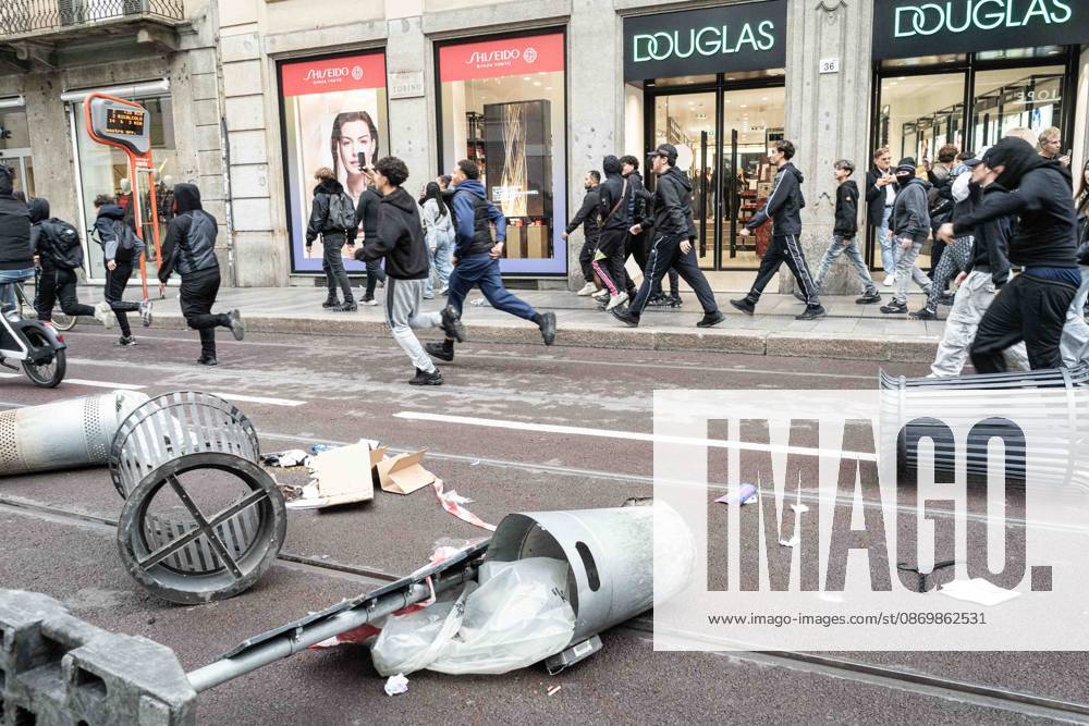 IPA89865083 - Milan: More Clashes and Looting by Hooded Youths in Downtown Milan the Day After the Protest on Saturday, the 17th