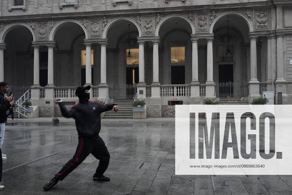 IPA89866342 - Milan: Clashes and looting by hooded youths continued in the city center the day after the demonstration on Saturday, the 17th; many hooded individuals were detained and taken to police headquarters.