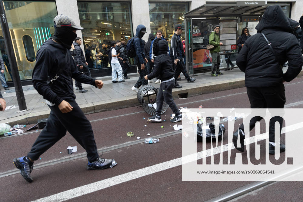 IPA89867905 - Milan, October 18, 2026: More Clashes and Looting in Downtown Milan the Day After the Protest; Pictured: Via Torino Rioters Storm In